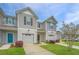 Charming townhome featuring a one-car garage, beautiful landscaping, and a welcoming entrance at 164 Buchanan Cir, Goose Creek, SC 29445