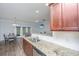 Modern kitchen with granite counters, stainless steel appliances, and a breakfast bar overlooking the dining area at 164 Buchanan Cir, Goose Creek, SC 29445