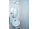 Powder room featuring a pedestal sink, an oval mirror and modern lighting at 164 Buchanan Cir, Goose Creek, SC 29445