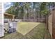 Large, fenced-in backyard with a covered pergola, perfect for outdoor entertaining and relaxation at 176 Daniels Creek Cir, Goose Creek, SC 29445