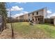 Large backyard featuring a wooden pergola, a fire pit, and a bench seating area at 176 Daniels Creek Cir, Goose Creek, SC 29445