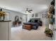 Primary bedroom with gray walls, carpet flooring, ceiling fan, gray upholstered bed and decorative wall decor at 176 Daniels Creek Cir, Goose Creek, SC 29445
