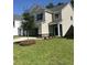 Beautiful home with a spacious front yard, stone accents, and a two-car garage at 176 Daniels Creek Cir, Goose Creek, SC 29445
