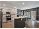 Modern kitchen with stainless steel appliances and gray cabinets at 176 Daniels Creek Cir, Goose Creek, SC 29445