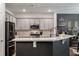 Modern kitchen with gray cabinets and stainless steel appliances at 176 Daniels Creek Cir, Goose Creek, SC 29445