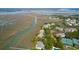 Stunning aerial view of condos and waterfront homes by a salt marsh with deep water access at 1806 Long Bend Dr, Seabrook Island, SC 29455