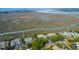 Nice aerial view of neighborhood with boat dock, tennis courts and waterfront condos at 1806 Long Bend Dr, Seabrook Island, SC 29455
