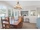 Inviting dining area with bright windows and a view into a modern kitchen and open living space at 1806 Long Bend Dr, Seabrook Island, SC 29455