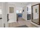 Inviting entryway with tile flooring that flows into a bright, open living space with a modern kitchen at 1806 Long Bend Dr, Seabrook Island, SC 29455