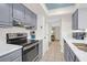 Stylish kitchen featuring stainless steel appliances, granite countertops and overhead cabinets at 1806 Long Bend Dr, Seabrook Island, SC 29455
