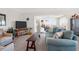 Comfortable living room with plush seating, a large TV, and a seamless transition to a sunroom at 1806 Long Bend Dr, Seabrook Island, SC 29455
