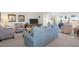 Bright living room with cozy seating, media setup, and views into an adjacent sunroom and sitting area at 1806 Long Bend Dr, Seabrook Island, SC 29455