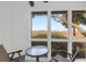 Relaxing screened patio with chairs and table overlooking the marshland at 1806 Long Bend Dr, Seabrook Island, SC 29455
