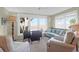 Charming sunroom with marsh views, comfortable seating and a dining area filled with natural light at 1806 Long Bend Dr, Seabrook Island, SC 29455