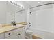 Bright bathroom with a sleek vanity, black fixtures, a framed mirror, and tub with shower at 200 Bucksley Ln # 105, Charleston, SC 29492