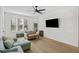 Bright living room with a ceiling fan, wood floors, comfortable seating, and ample natural light at 200 Bucksley Ln # 105, Charleston, SC 29492