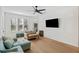Bright living room featuring hardwood floors, a ceiling fan, and comfortable seating at 200 Bucksley Ln # 105, Charleston, SC 29492