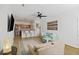 Bright living room with hardwood floors, modern ceiling fan, open kitchen and comfortable seating area at 200 Bucksley Ln # 105, Charleston, SC 29492