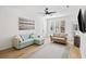 Comfortable living room with a view to the front door and outdoor access at 200 Bucksley Ln # 105, Charleston, SC 29492
