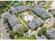 Aerial view of colorful apartment complex featuring a pool, cabana, lush landscaping, and parking at 2022 Chatelain Way, Mount Pleasant, SC 29464