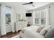 Bright bedroom with dresser, large windows and ceiling fan at 2022 Chatelain Way, Mount Pleasant, SC 29464