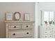 Bedroom dresser with mirror, plants, and artwork at 2022 Chatelain Way, Mount Pleasant, SC 29464