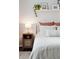 Comfortable bedroom features cozy bedding, decor, and a stylish nightstand with a lamp at 2022 Chatelain Way, Mount Pleasant, SC 29464