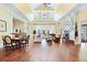 Spacious clubhouse with hardwood floors, fireplace, lounge areas, and tables for residents at 2022 Chatelain Way, Mount Pleasant, SC 29464