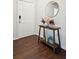 Inviting entryway with a wooden console table, decorative mirror, and hardwood flooring at 2022 Chatelain Way, Mount Pleasant, SC 29464