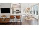 Modern kitchen with white cabinets, stainless steel appliances, and a breakfast bar with brown leather stools at 2022 Chatelain Way, Mount Pleasant, SC 29464