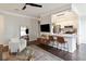 Open-concept living room with a kitchen view, comfortable seating, and a modern design at 2022 Chatelain Way, Mount Pleasant, SC 29464