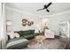Bright living room with a green sofa, a decorative rug, and stylish decor at 2022 Chatelain Way, Mount Pleasant, SC 29464