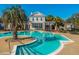 Resort-style pool with inviting turquoise water, palm trees, and comfortable lounge chairs for relaxing poolside at 2022 Chatelain Way, Mount Pleasant, SC 29464