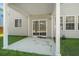 Backyard with a covered patio and sliding glass doors at 206 Woodbrook Way, Moncks Corner, SC 29461