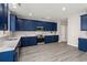 Beautiful kitchen with blue cabinets, stainless steel appliances, and marble countertops at 206 Woodbrook Way, Moncks Corner, SC 29461