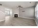 Bright living room with sleek flooring, a fireplace, and expansive windows offering natural light at 206 Woodbrook Way, Moncks Corner, SC 29461