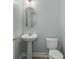 Clean half bathroom with a pedestal sink and a toilet at 206 Woodbrook Way, Moncks Corner, SC 29461