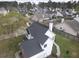 Aerial view of a residential neighborhood showcasing a home with a dark roof and well-kept yards at 223 Westbrooke Rd, Summerville, SC 29486