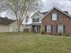 Attractive two-story home featuring brick accents, black shutters, and a neatly landscaped front yard at 223 Westbrooke Rd, Summerville, SC 29486
