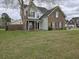 Inviting two-story home with a classic brick and siding exterior, covered entry, and grassy front yard at 223 Westbrooke Rd, Summerville, SC 29486