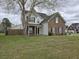 Charming two-story home with brick accents, inviting front porch, and well-maintained lawn at 223 Westbrooke Rd, Summerville, SC 29486