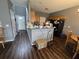 Functional kitchen featuring wood cabinets, laminate flooring, and spacious gray countertop at 223 Westbrooke Rd, Summerville, SC 29486