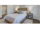 This bedroom showcases a comfortable bed with decorative pillows, and natural light from the window at 2279 Macallan Blvd, Ravenel, SC 29470
