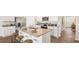 Well-lit kitchen featuring an island with bar stools, stainless steel appliances, and granite countertops at 2279 Macallan Blvd, Ravenel, SC 29470