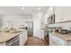 Modern kitchen featuring granite countertops, stainless steel appliances, and white cabinetry at 2279 Macallan Blvd, Ravenel, SC 29470