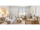 Comfortable living room with a large sofa, stylish decor, and view of the neighborhood at 2279 Macallan Blvd, Ravenel, SC 29470