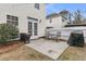 Backyard patio featuring an outdoor kitchen, string lights, and privacy fence at 2369 Chadbury Ln, Mount Pleasant, SC 29466