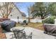 A backyard featuring a patio, firepit with chairs, outdoor kitchen, and storage shed at 2369 Chadbury Ln, Mount Pleasant, SC 29466