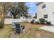 View of the backyard featuring a firepit, wooden chairs, string lights, and privacy fence at 2369 Chadbury Ln, Mount Pleasant, SC 29466