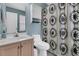 Functional bathroom featuring a patterned shower curtain, a single vanity, a toilet and blue painted walls at 2369 Chadbury Ln, Mount Pleasant, SC 29466